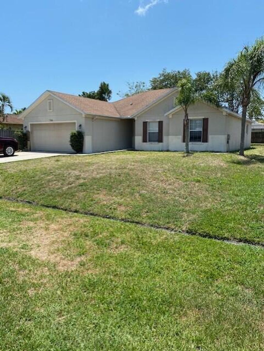 Photo of 766 SE Norcross Avenue, Port Saint Lucie, FL 34983 (MLS # R10995936)