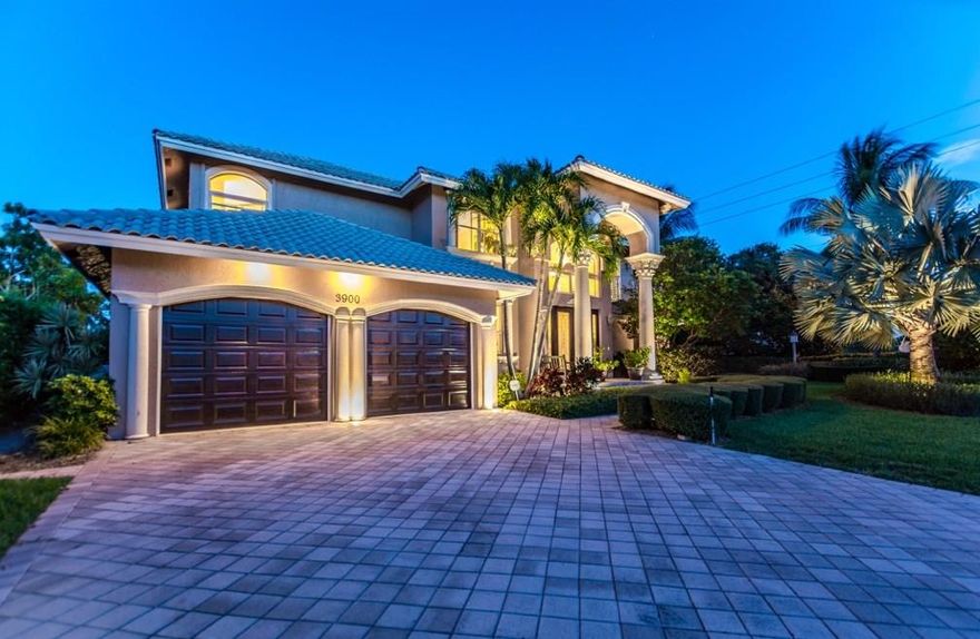 Enter this awesome open floor plan home through the double entry wood & lead glass doors into the raised foyer. 90 feet of waterfront on a deep water canal with no fixed bridges to the Intracoastal and Inlet plus desirable east exposure. 5 bedrooms plus den, 2 of them masters- one on the 1st & one on the 2nd floor. Impact windows and doors. Wonderful kitchen island, snack bar, and breakfast area, all opening to the family room & outdoors. Formal living & dining areas, high ceilings, incredibly lush, private outdoor area w/ extensive lighting, heated pool & spa and private dock for large boat!  The pool was recently refinished with a new surface and new tile.  The polymer dock is new as well!