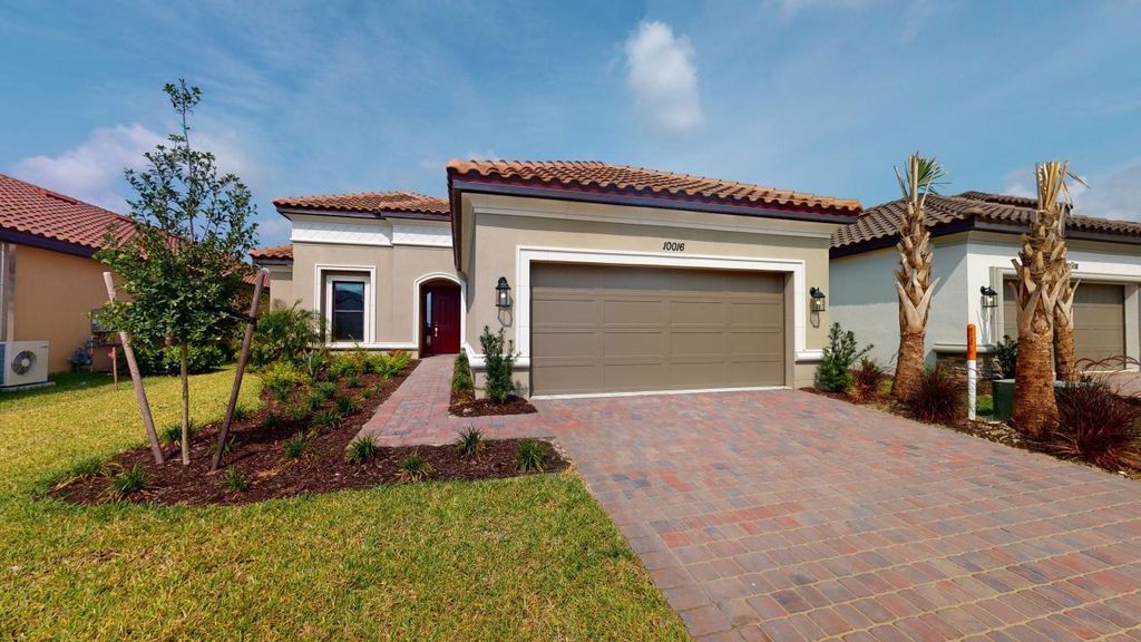 Photo of 10016 SW Cloister Drive, Port Saint Lucie, FL 34987 (MLS # F10416527)