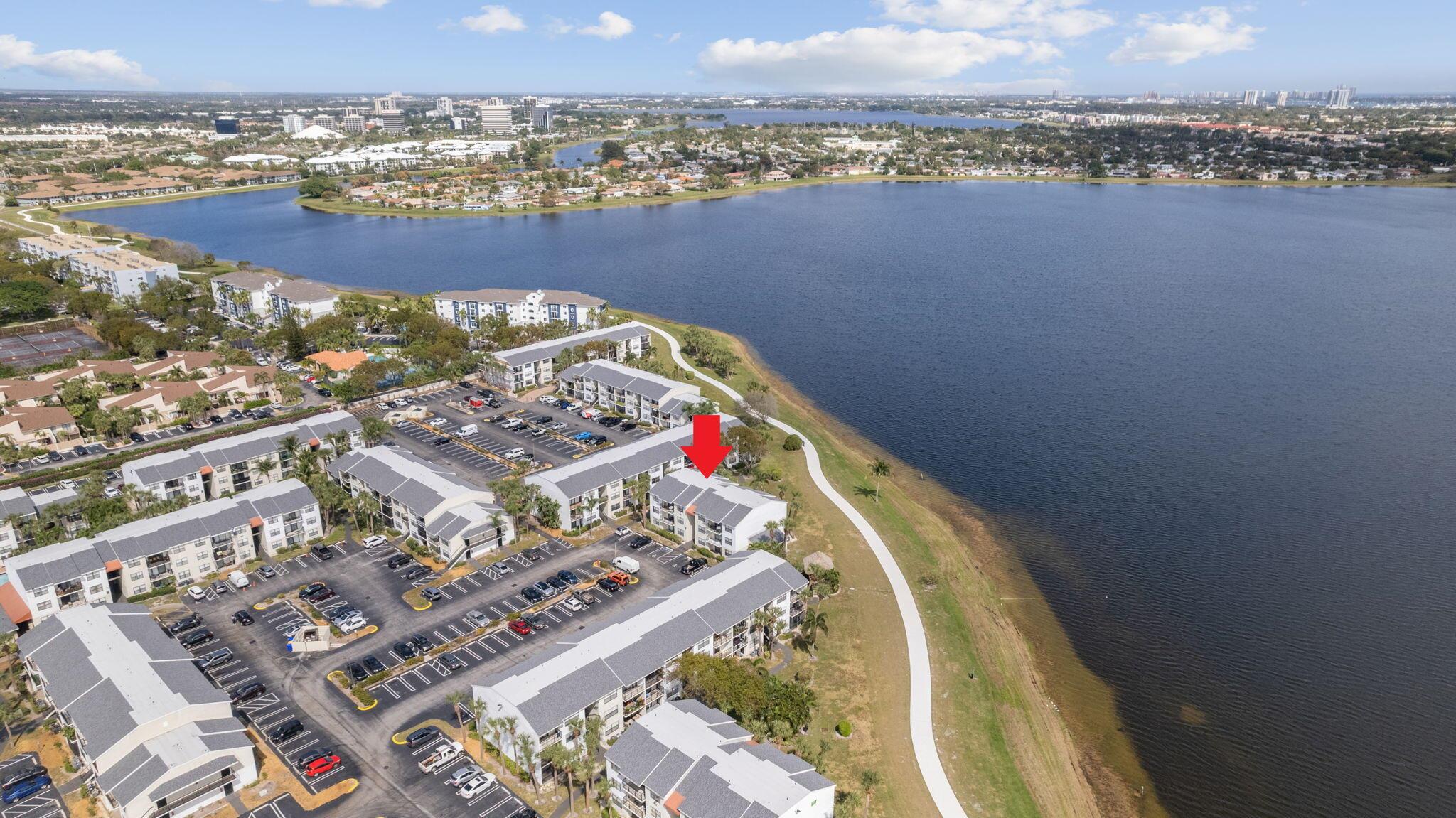 One- of- a- kind updated waterfront condo with downtown city skyline views. 2 master suites, 2 bathrooms with water views from every window and granite countertops throughout. Washer and dryer in unit. Enjoy BBQ by the tiki hut soaking in the views, with pool and gym on site. Just minutes from the shops and restaurants at Palm Beach Outlets and I-95. Quick move-in available for this rare opportunity.