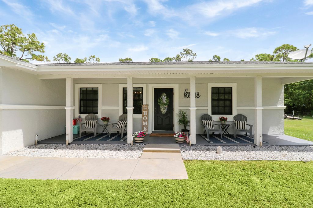 Photo of 17355 92nd Lane N, The Acreage, FL 33470 (MLS # R11005906)