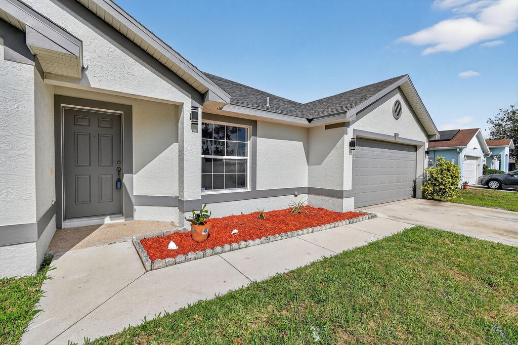 Photo of 1714 SE Aneci Street, Port Saint Lucie, FL 34983 (MLS # B26008657)