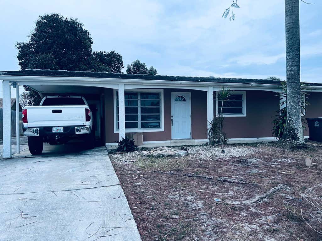 Photo of 938 Sarazen Drive, West Palm Beach, FL 33413 (MLS # R11165853)