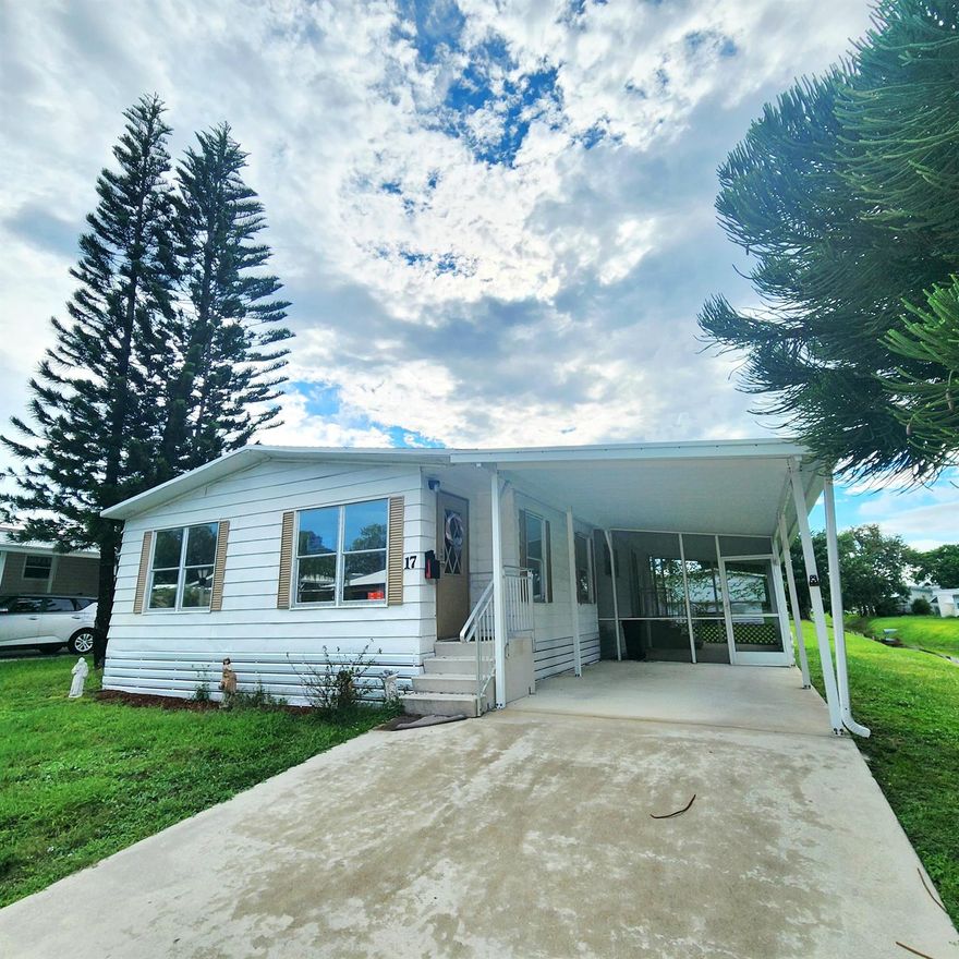 Charming, spacious 2bed/2bath home w/ beautiful water views. Roof 2020! Large screened in porch, perfect to watch the ducks & birds glide by. You will be pleased w/ this prime location; close to the beach, mall, grocery stores, shopping, post office, banks, hospitals & more. Lot lease 842.53 includes security, cafe, Clubhouse w/activities, lawn care, trash, free private golf course, bingo, heated pool, pickleball, tennis, workshop, shuffleboard, bocce, gym, library, cards, Mahjong, clubs & more! Grab your slice of paradise in the highly desired town of Port St Lucie!