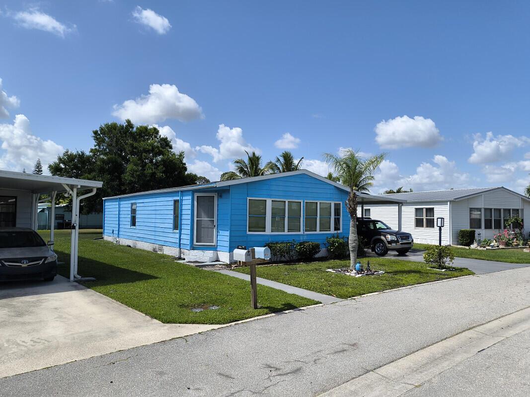This manufactured home is located in the La Buona Vita Co op community in Port St Lucie Florida. It is outdated and in need of some remodeling, as the low price reflects. But a small investment would easily put it back in the value range of other properties in the area. On top of that it is in a very nice retirement community with a very low HOA fee of $197 .00 per month and you own a share of the land. That includes: Cable, Internet, Trash pickup and Pool/Clubhouse access within 100 yards and a multitude of activities going on every week. The living room area is very spacious as are the master and guest bedroom. The sq. ft living space reflects that of a three bedroom house. So this being two bedroom leaves you with two nice walk in closets in the master bedroom and large bathroom