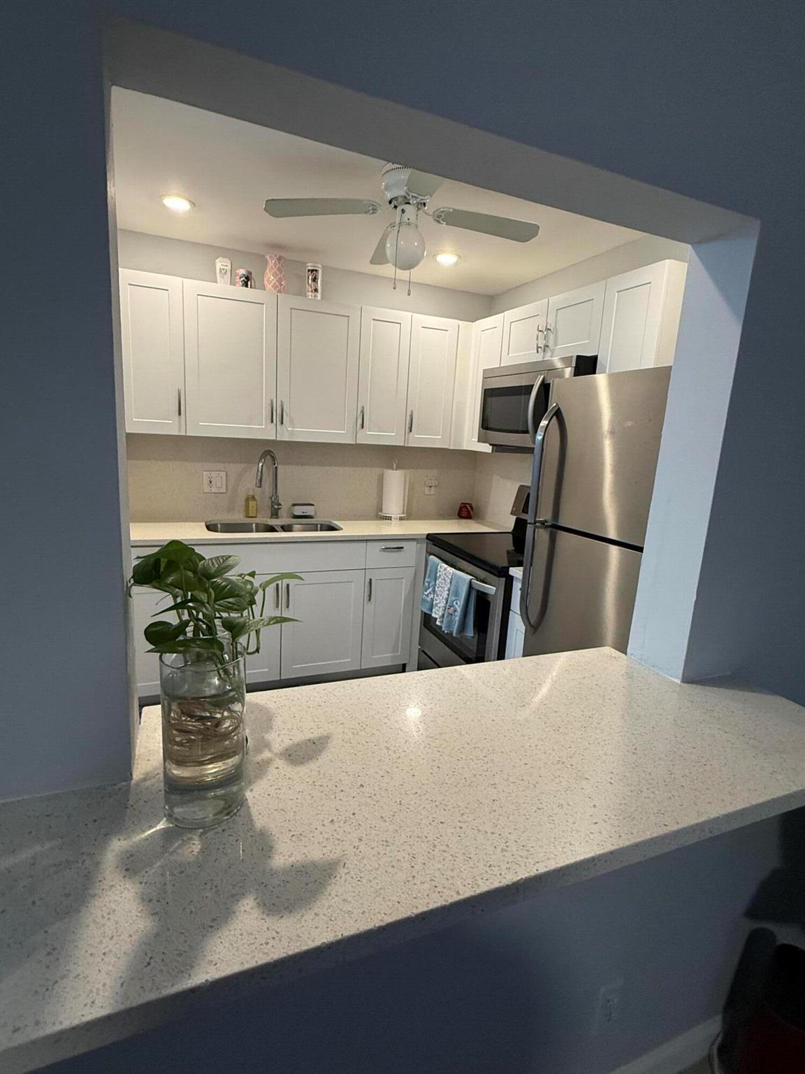 Come a take a look at this beautifully remodeled 55 plus condo in the heart of Palm Beach. The kitchen has a white quarts counter top and stainless still appliances. This friendly neighborhood is conveniently located, near shopping, super markets, gas stations and restaurants, just minutes away from I95. The community has great amenities (Clubhouse, Gym/finess room, Pool, Shuffleboard Court, Putting Green and Ballard Room). This is an active adult community with plenty to do.