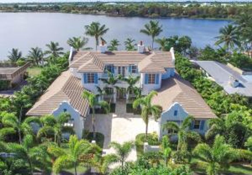 Newly completed and available for immediate occupancy, Direct Waterfront Estate, located in Delray's most desirable, family-friendly Lake Ida neighborhood; minutes from the beach and the shops and restaurants of Atlantic Avenue.  Built by Azure Development and designed by renowned architect Richard Jones, the home is set on three quarters of an acre with over 100' of lake frontage on the widest section of Lake Ida.This lakefront estate is the ultimate "activity" house. Tucked away at the end of a private street you arrive at an expansive motor court with four-car garage. From the front entry your eyes are immediately drawn through the expansive living/dining room to the 55' long infinity edge pool that appears to flow directly into the lake.  Backyard features include a private beach