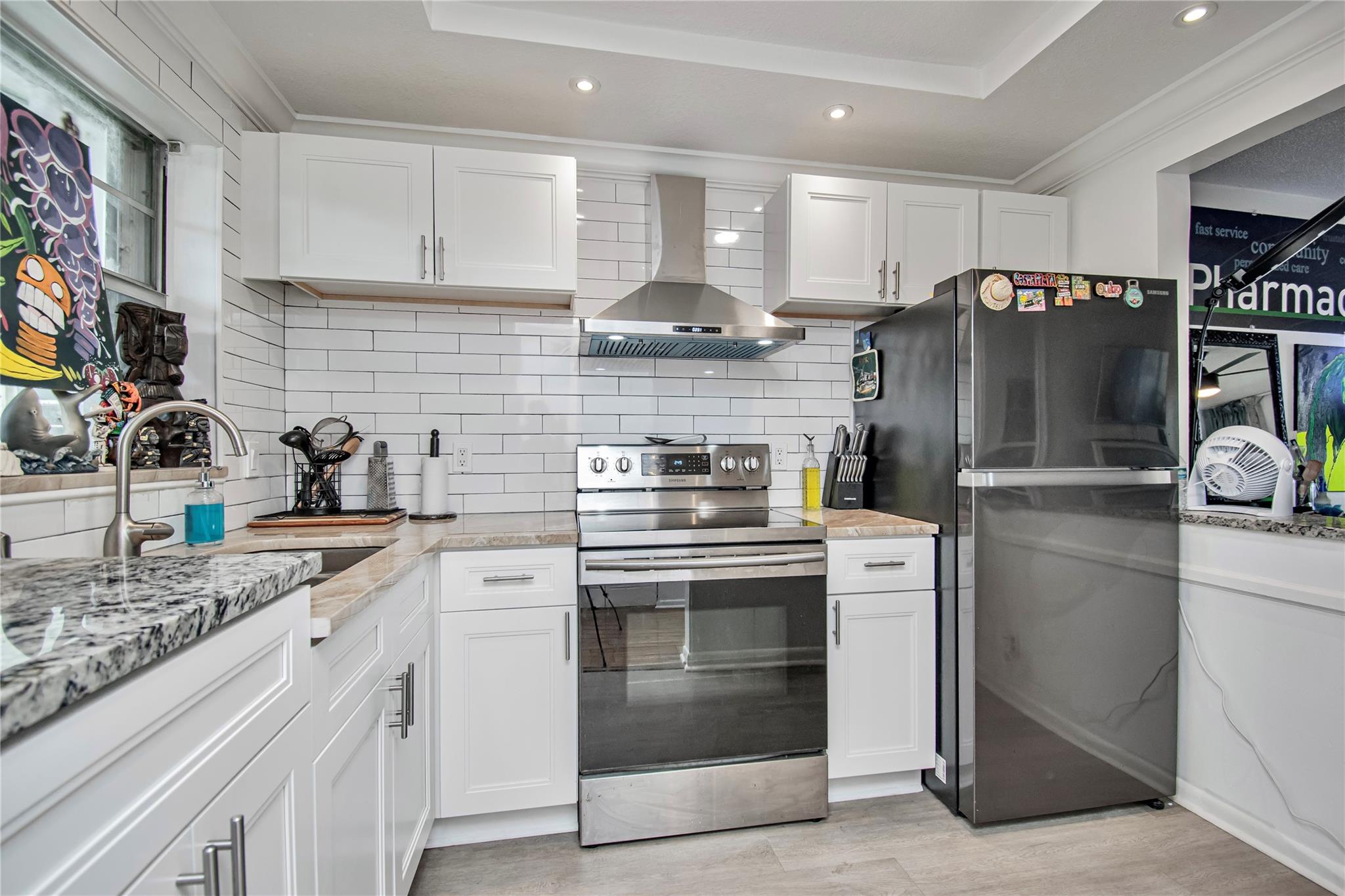 Absolutely stunning 2-bed, 2-bath condo, minutes from Downtown West Palm Beach, CityPlace, and pristine beaches! Enjoy a short walk to the Palm Beach Outlets from this completely renovated gem. The beautifully updated & open-concept kitchen boasts divine marble countertops and an island, perfect for entertaining. Gleaming wood floors flow throughout, complimenting the exquisitely renovated bathrooms with new vanities and elegant tiles. Relax on the large screened-in balcony, also great for hosting & entertaining. This unit also includes a large separate storage closet. Never worry about parking for family & friends with ample guest parking spaces. Association has reserves and the proper insurance for conventional loans! Also Investor friendly with no waiting period to rent! Don't miss out!
