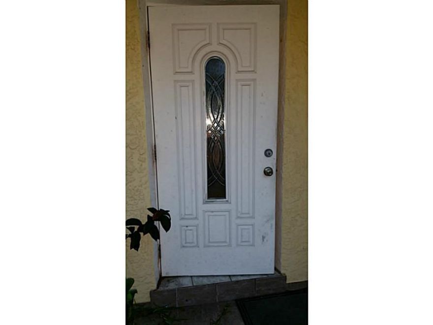 The home also has an outside bar, additional shower outside with both hot and cold water. The kitchen was updated with granite counter tops  and beautiful new cabinets  as well as the master bathroom is all updated and new. The floor plan on this home fee ls spacious and allows for privacy in the master bed and bath on one side and the other two bedrooms on the other. There is a large patio space, bar and bar-b-q out back for entertaining. Please do not explore or go out back without the Realtor!