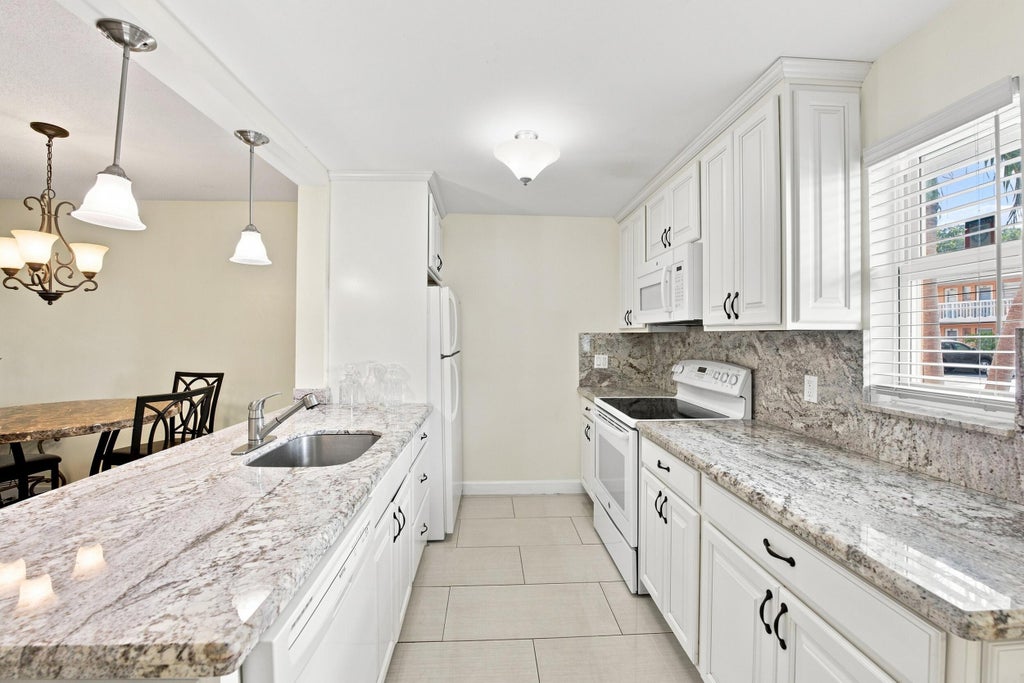 Photo of 2223 NE 1st Court #101, Boynton Beach, FL 33435 (MLS # B26091424)