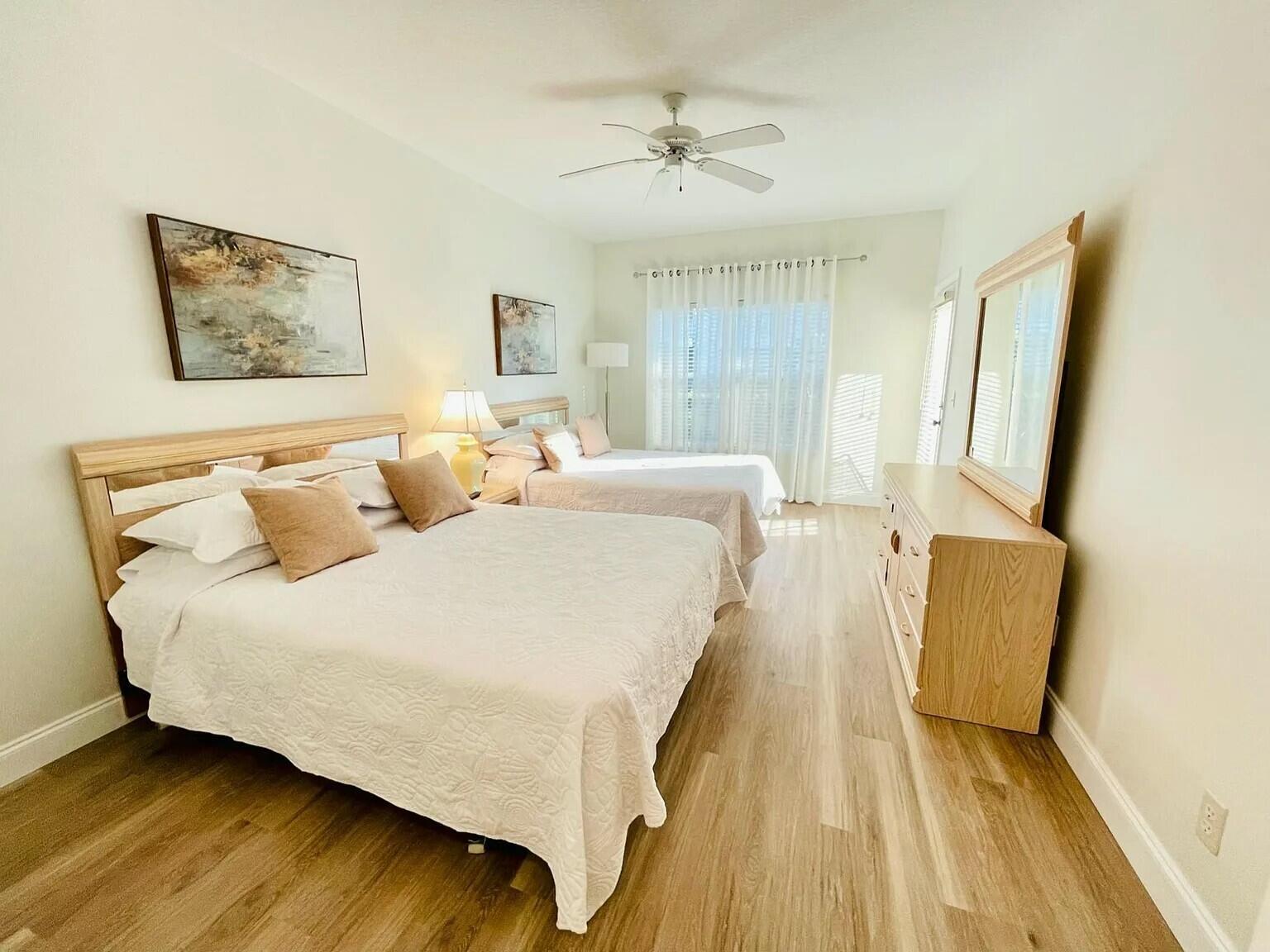 Stunning remodeled fully furnished turnkey 1st floor no stairs 1 bed 1 bath condo. Super clean available 5/1/25 Golf Villa A Side. Freshly painted, newer bed, all newer dishes and silverware. Across from resort style pool and mailboxes. Inside, you'll find brand new flooring throughout, a remodeled main shower with modern finishes, and a fully furnished living space ready for move-in. The kitchen features an upgraded dishwasher, refrigerator, and stove all installed just two months ago. Enjoy quiet mornings or evenings on the spacious screened-in patio overlooking green space. Close to 95 access, Mets stadium, shopping & restaurants and much much more.