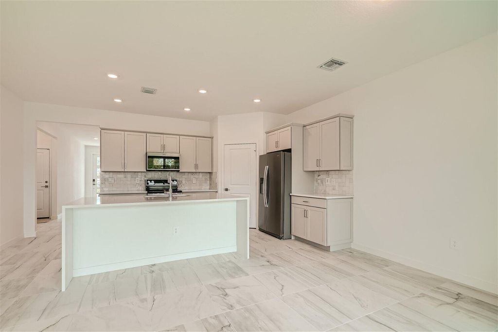 Photo of 1907 NE Ocean Dunes Drive, Jensen Beach, FL 34957 (MLS # R10908061)