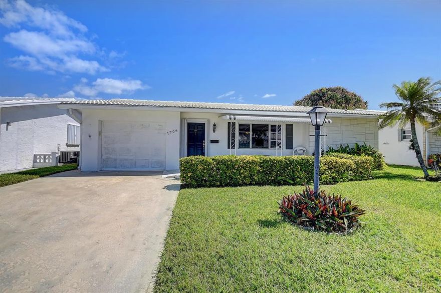 Waterfront home!! Extended Challenger model on lake Constantine. One of the nicest locations in Leisureville.  Nice big double driveway. Front patio. Open kitchen, Split bedroom plan for more privacy. Fans through out. New water heater. Phantom screen on front door. Screened covered patio. Beautiful panoramic views of the water. Sea wall replaced paid rec lease.  Active community clubhouse pool shuffle board golf billiards bocce courts fitness center gife shop and more. Close to shopping beaches hospitals highways ect.