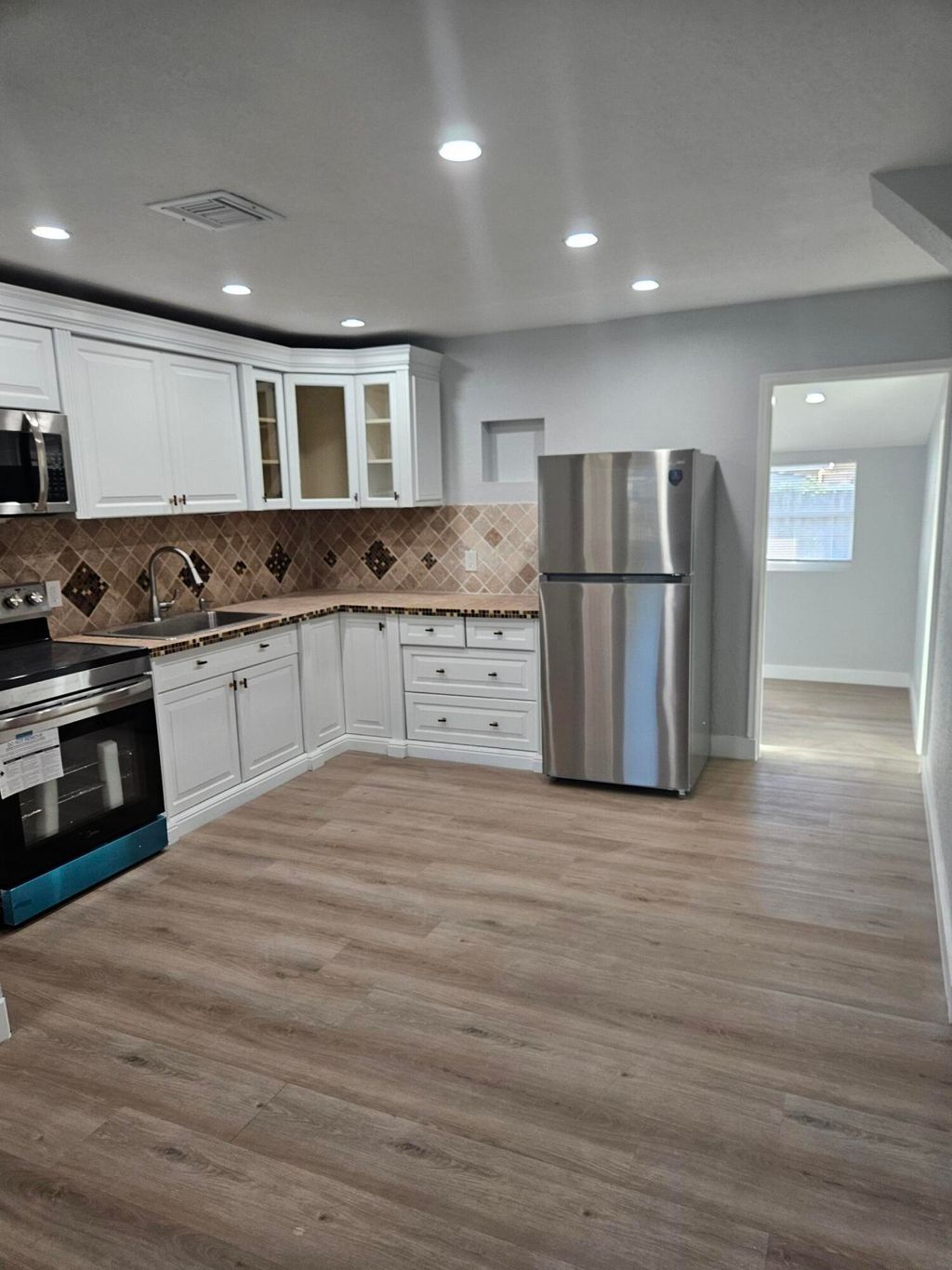 Photo of 720 Locust Street, West Palm Beach, FL 33405 (MLS # R11169927)