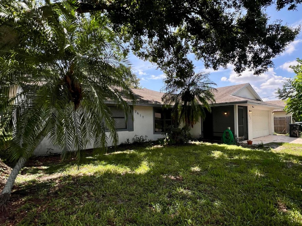 Photo of 2617 SW Chestnut Lane, Port Saint Lucie, FL 34953 (MLS # R11150542)