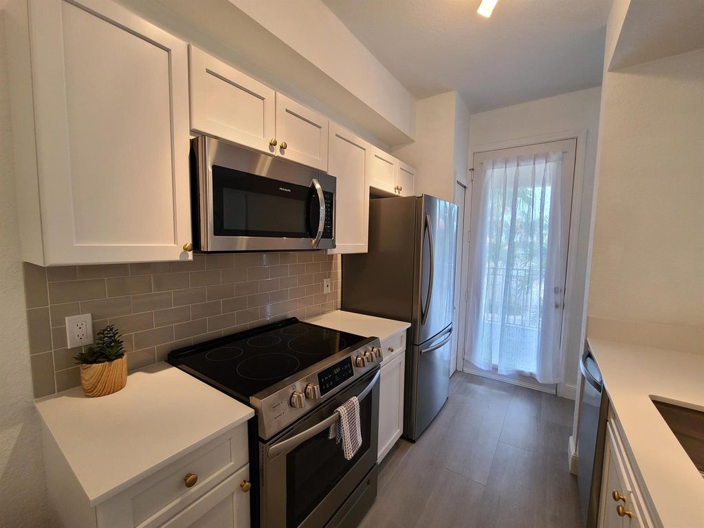 Photo of 11011 Legacy Lane #304, Palm Beach Gardens, FL 33410 (MLS # R11057041)