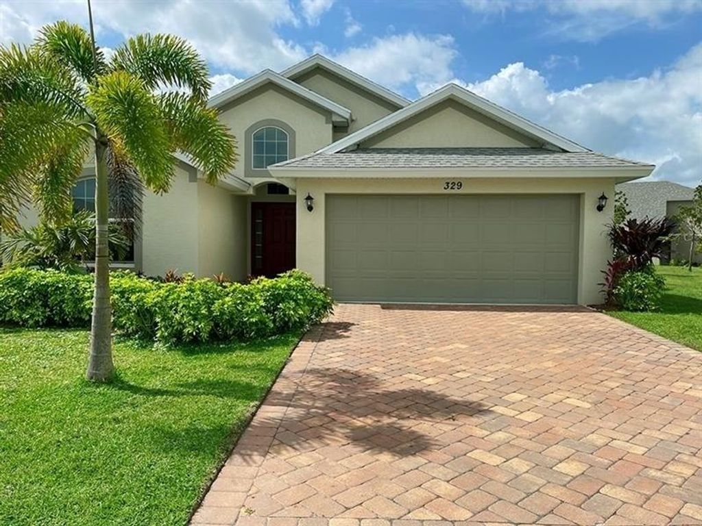 Photo of 329 Palm Breezes Dr, Fort Pierce, FL 34945 (MLS # F10525324)