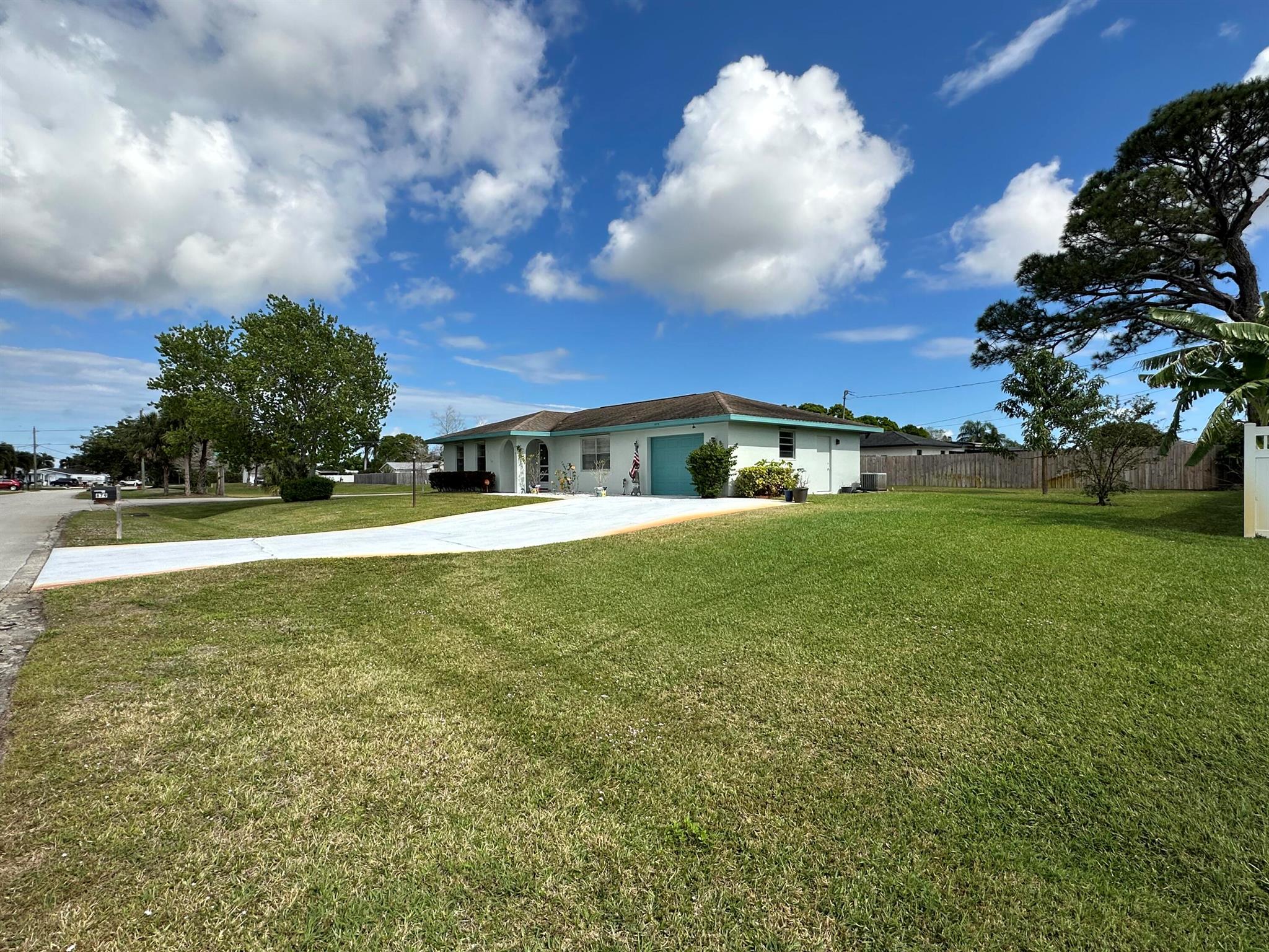 Charming 2-bedroom, 2-bathroom single-family home nestled in the heart of Port Saint Lucie, FL. This property sits on a spacious lot, offering endless possibilities for outdoor living and entertaining. The exterior walls are made of concrete blocks. It also has aluminum storm shutters for the entire house, except for the porch. The master bathroom features a special bathtub with an integrated seat and jets. Additionally, it has well water for the sprinklers. Conveniently located near major highways, shopping centers, restaurants, and beautiful beaches, this home is perfect for enjoying Florida's lifestyle. Plus, it's within close proximity to top-rated schools, making it an excellent choice for families. Don't miss the opportunity to make this home yours!