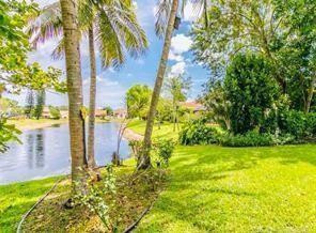 Photo of 6310 NW 58th Way, Parkland, FL 33067 (MLS # F10530333)