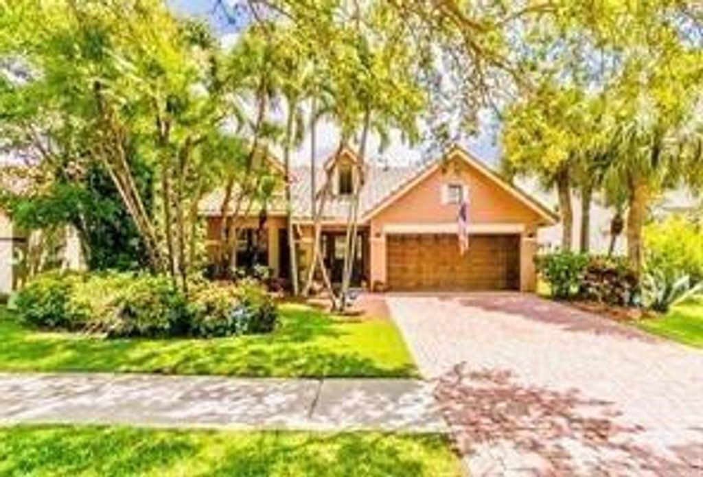 Photo of 6310 NW 58th Way, Parkland, FL 33067 (MLS # F10530333)