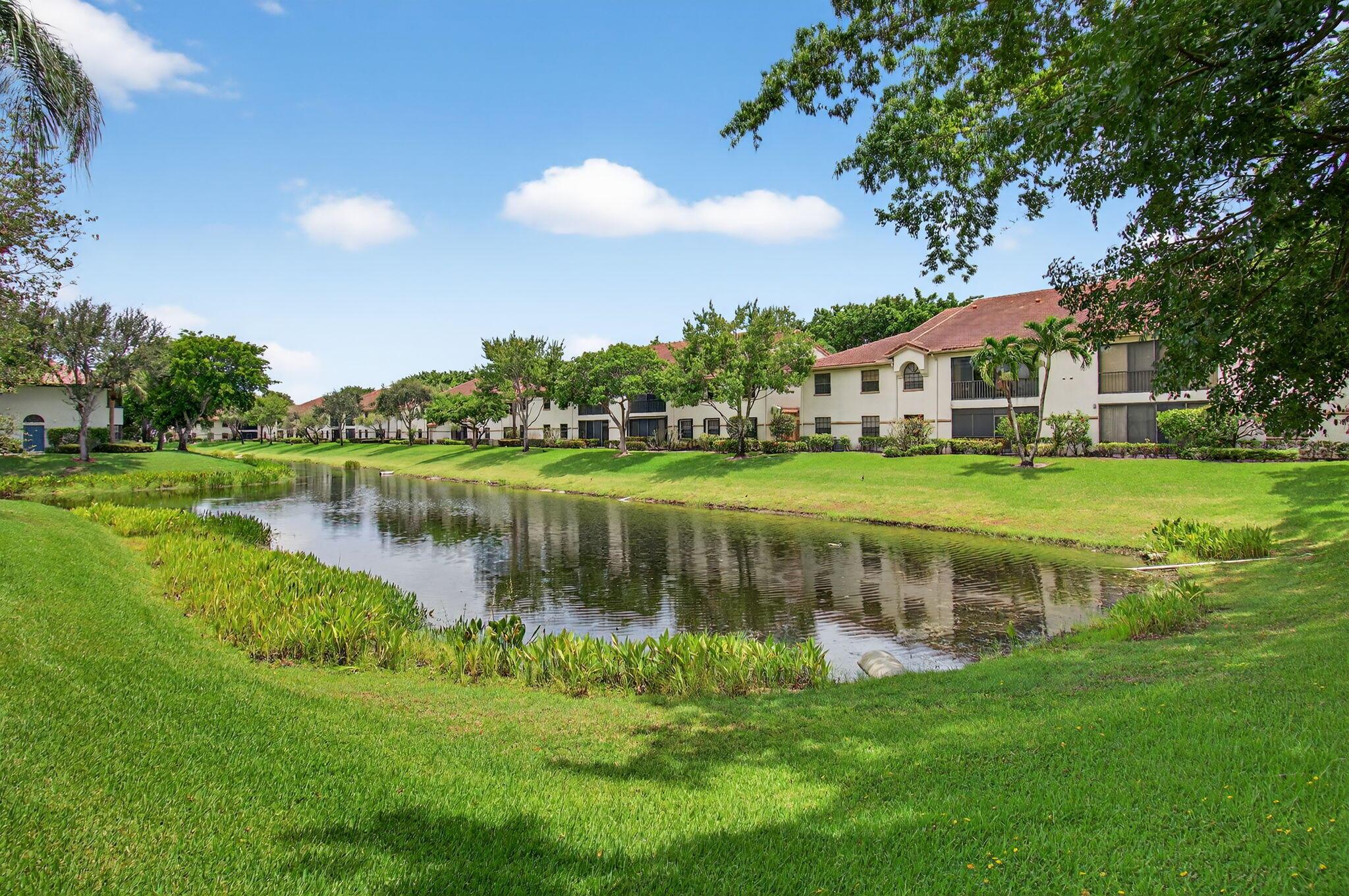 EXPERIENCE THIS STUNNINGLY AFFORDABLE WATER VIEW 3BR/2BA condo with elevator access in the all-ages gated community of resort-style Platina in Boynton Beach! Enjoy vaulted ceilings for a spacious feel, a window-enclosed balcony, a large kitchen with stainless steel appliances and eat-in area, and a washer/dryer in unit. The primary suite features a walk-in closet and en-suite bath. The enclosed balcony and all 3 bedrooms have views overlooking the water. Dues include water, sewer, cable (DirecTV), and internet. The community offers 3 on-premises pools, tennis courts, pickleball, shuffleboard, and a modern clubhouse with a cafe open for breakfast and lunch. An unbeatable price for this Florida gem--schedule a showing today!