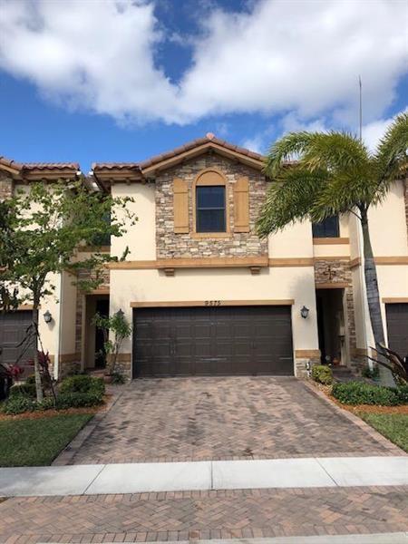 Large 4 bedroom 3.5 bathroom townhouse in Town Parc. Over sized unit with all impact windows and expansive water views. Upgraded kitchen with stainless steel appliances, beautiful flooring throughout, private backyard with one of the longest lake views, and 2 car garage. Second floor has 4 bedrooms and 3 bathrooms. Master features large walk-in closets, separate tub/shower. 1 bedroom has an on suite bathroom. Laundry located upstairs. A rated schools, full amenities, clubhouse, gym, playground, pool and access to amenities at the 2 state of the art club houses.