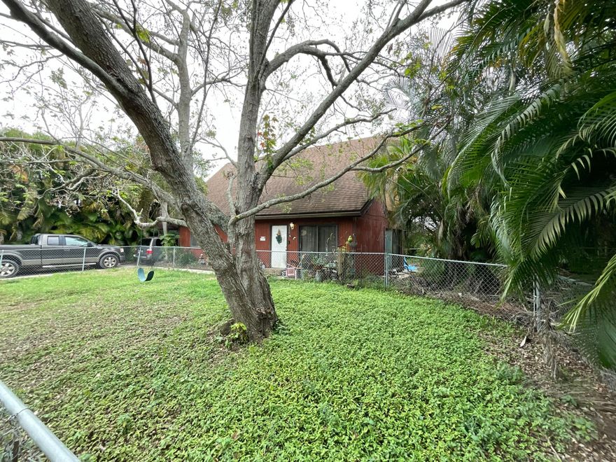 Situated on a 0.41-acre canal-front parcel in Lake Worth, this architecturally distinctive A-frame offers a compelling value-add and redevelopment opportunity. The 3BR/2BA home features vaulted ceilings, exposed beams, and an open layout with two bedrooms on the main level and a lofted primary suite above. Expansive windows and French doors lead to a large deck overlooking the canal. Property includes two HVAC systems, laundry, utility space, driveway, and carport. Zoned to allow subdivision into two single-family lots, offering multiple strategies: renovate, redevelop, or hold as a covered land play. Ideal for investors, builders, or end-users seeking a waterfront opportunity with upside. Positioned on an oversized 0.41-acre parcel along a tranquil canal in Lake Worth, this architecturally distinctive A-frame residence presents a compelling value-add and redevelopment opportunity in a supply-constrained submarket.  The existing improvements feature a 3-bedroom, 2-bath wood-frame home with a highly desirable open floor plan anchored by soaring vaulted ceilings, exposed timber trusses, and tongue-and-groove wood decking, delivering volume and character rarely found at this price point. The layout includes two bedrooms on the main level and a second-floor loft and primary suite, creating functional separation and flexible living configurations.  Natural light pours into the main living area through expansive glazing, seamlessly connecting the interior to a large wood deck overlooking the canal, accessed via French doors—an ideal canvas for repositioning into a lifestyle-driven product. Operationally, the property is supported by two HVAC systems, a dedicated laundry room, utility space, concrete driveway, and carport. From an investment perspective, the true upside lies in the land. The 0.41-acre site offers sufficient density, per zoning, to subdivide into two single-family parcels, providing multiple exit strategies:  Renovate and capitalize on the existing structure  Redevelop into two new construction homes  Hold as a covered land play with future appreciation   The property is in fair condition and primed for renovation, making it well-suited for fix-and-flip investors, builders, or end-users seeking to create a custom waterfront residence.  This is a rare opportunity to control a large, subdividable homesite with architectural character and waterfront exposure—a combination that continues to outperform in today's market.