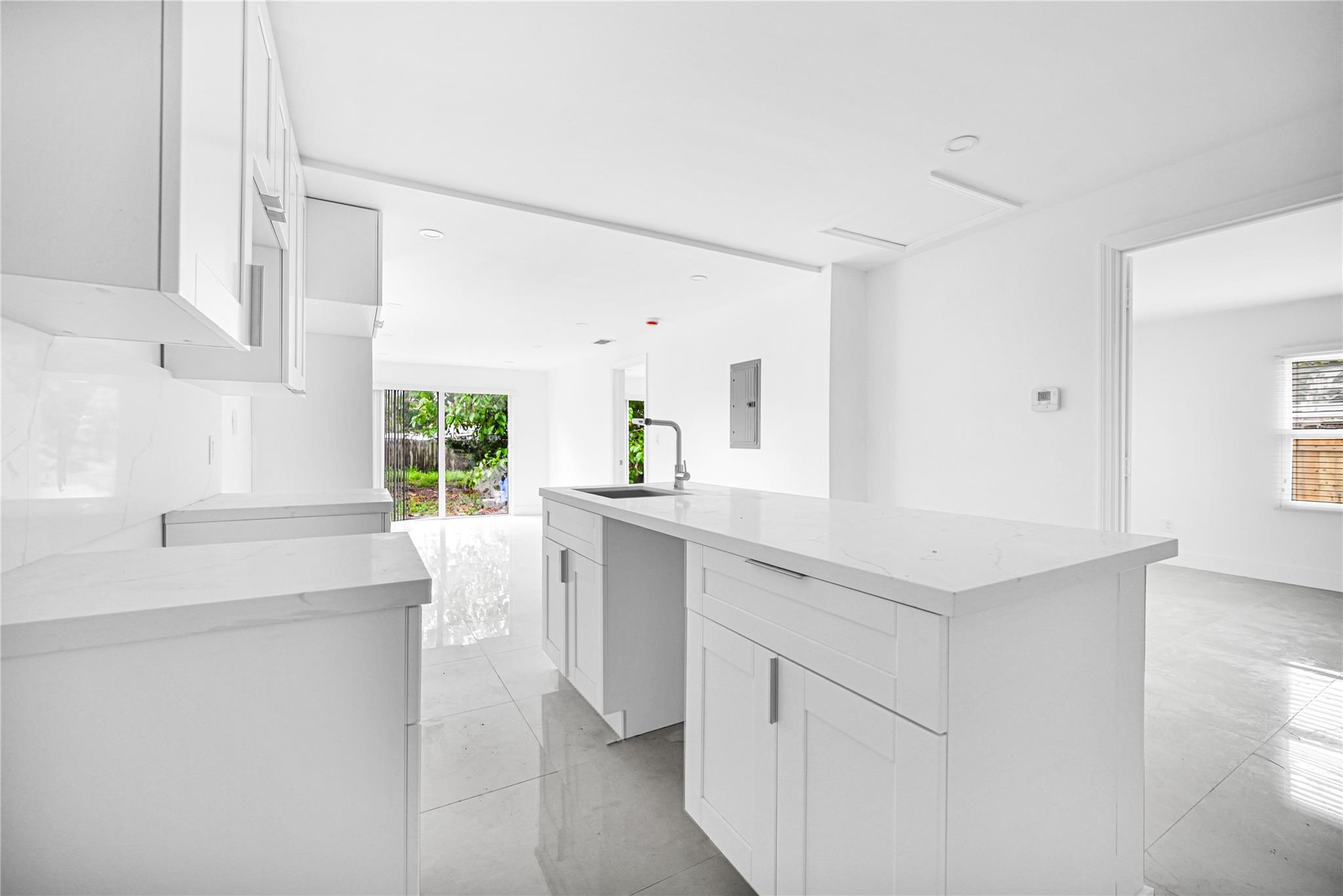 Nestled in the heart of the desirable Old Pompano neighborhood you will find this remodeled single-family home featuring 3 bedrooms and 2 bathrooms. Enjoy an open layout that is perfect for any occasion.. This home has been fully upgraded with a brand-new roof, stainless steel appliances, washer / dryer, impact doors and windows for peace of mind. Spacious layout with more square footage than reflected on the tax roll. Perfect opportunity for first-time homebuyers or investors. A few Blocks from Kester Park, offering playgrounds, ball fields, and green space for recreational activities, Pompano Pier, beaches, shopping, fine dining, and in close proximity to I-95.