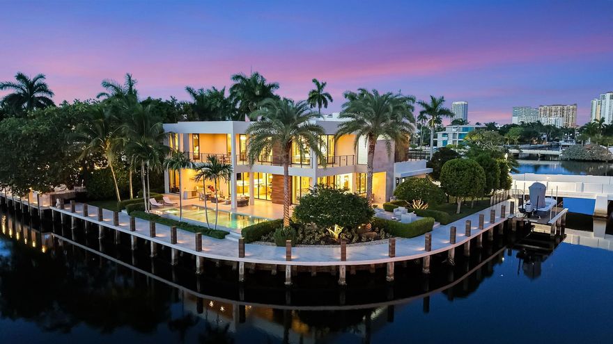 Prominent Las Olas peninsular. Custom point Estate with 362 ft deep water & stunning views from EVERY room! Offered fully furnished, design by D Deperro Design. Curated for an avid boater & entertainer. House walled & gated. Highest quality construction & custom finishes throughout. Crestron technology, security & generator. Dramatic entry & staircase. Rooms flow seamlessly, great room, bar, fireplace, ultimate Chef's kitchen, dining island & professional grade appliances, sliding glass doors pocket to pool area. Formal dining room & fireplace. Office, media room/VIP bedroom suite. Elevator. Exquisite large primary:separate spa style baths,2 custom closets (15x19 dressing room). Gym plus 2 large bedroom suites. Great water facing balcony. Fully equipped docks. 4 bay air conditioned garages