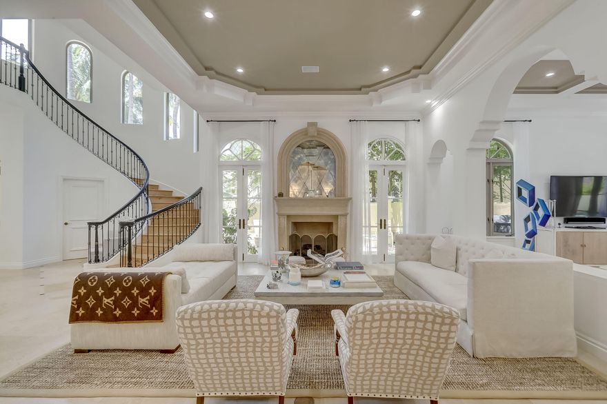 Stunning Contemporary Residence....MOVE IN READY! Located in the boutique enclave of Villa Flora within coveted Williams Island, this  Tuscan inspired house has been reimagined to reflect today's prevailing taste. A gorgeous 3 story, 5 bedroom & 4.5 bathroom property that feels just like a single family home with its exterior featuring a separate gated entrance, huge motor court,  2 car garage, private pool, covered decks & patios, and grill area. The interior is adorned with soaring ceilings, all impact windows and doors, a grand stairwell, elevator, spacious living, dining & family areas, gourmet kitchen (w/a gas range), water treatment system, 3 bedrooms w/ensuite baths, gym, fireplaces, media/theater room, art gallery, office ,lounge and more! Rare opportunity for the most discerning!