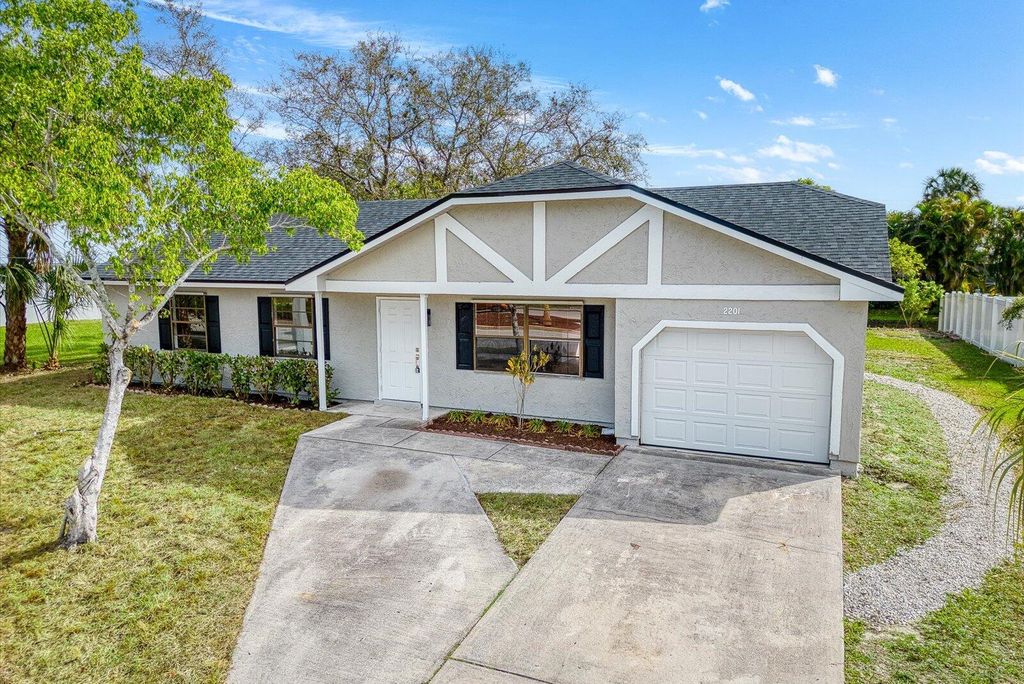 Photo of 2201 SE Lennard Road, Port Saint Lucie, FL 34952 (MLS # R11066379)