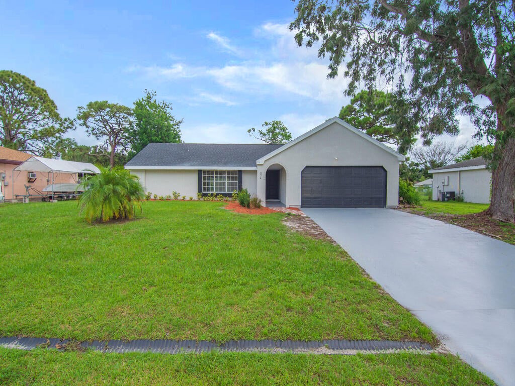 Photo of 374 SW Homeland Road, Port Saint Lucie, FL 34953 (MLS # B26079013)