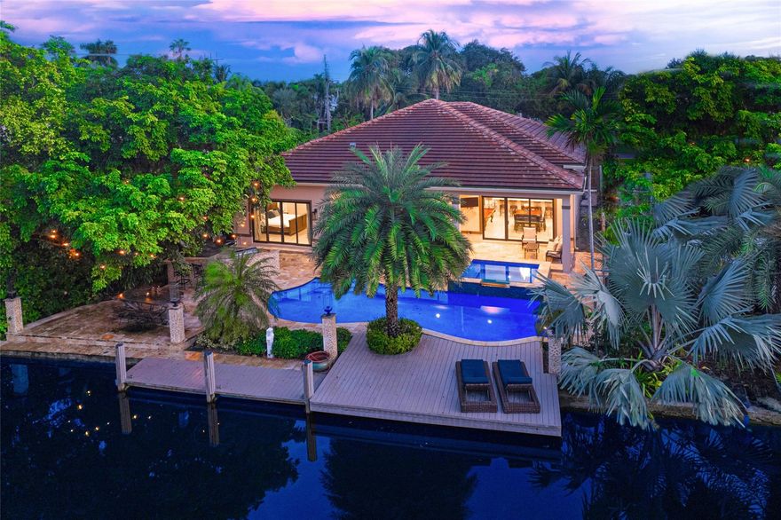 Welcome to the life of luxury in this newer built masterpiece located in highly desired Rio Vista. This home is the ideal tropical oasis, with a location second to none, 75ft on the water with over 10,000 square feet of land! The crystal blue heated swimming pool and spa overlooking tranquil quiet waters is the epitome of stylish outdoor living. You'll enjoy a massive state-of-the art kitchen boasting extravagant Viking appliances, SubZero climate-controlled wine cellar fridge, two drop-in stainless-steel sinks, and an extended island/counter space. There is a built-in sound system, built-in gas grilling area, and more! Step onto the covered patio area with a side bar, ceiling fans, adjacent to the jetted jacuzzi that waterfalls into the sparkling pool. Lush landscaping surround the pool.