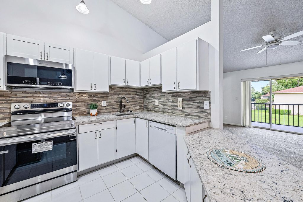 Photo of 6572 Chasewood Drive #F, Jupiter, FL 33458 (MLS # R11044979)