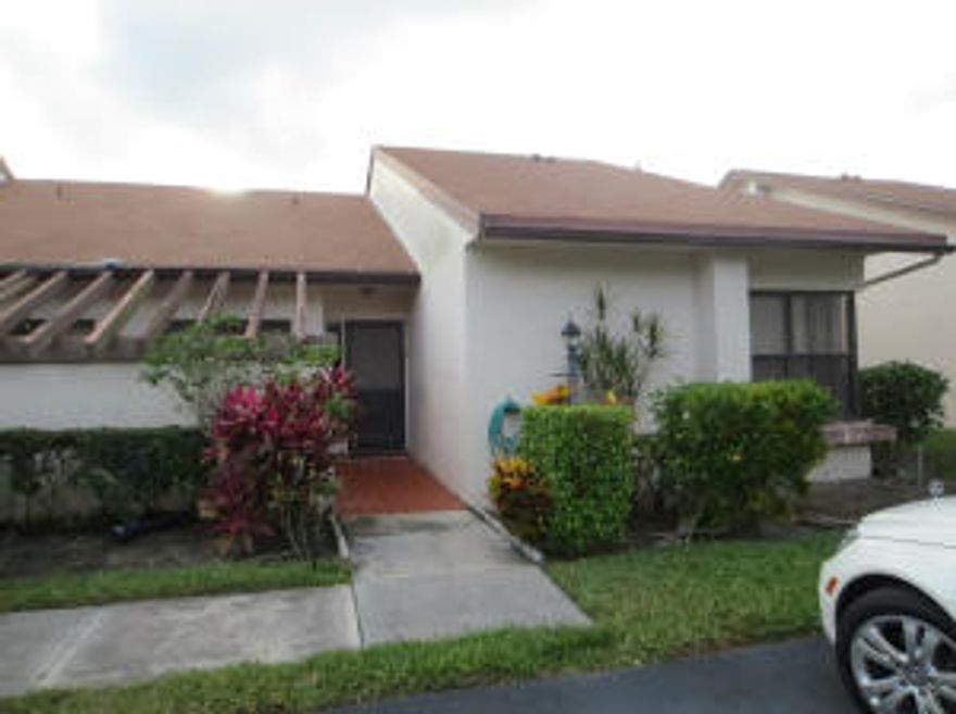 RARE FIND! CORNER VILLA WITH ADDED SQUARE LIVING. IT IS A 2/2 BUT THE 3RD BEDROOM AREA IS OPEN FOR ADDED SOCIAL SQUARE FOOTAGE (COULD BE CONVERTED TO 3 BR). UNIT WAS REMODELED WITH NEW KITCHEN CABINETRY, UPGRADED WHIRPOOL STAINLESS STEEL APPLIANCE PACKAGE (1 YR NEW), GRANITE COUNTER TOPS AND A DEDICATED BREAKFAST AREA. NEW PORCELAIN TILES THROUGHOUT AND LAMINATE WOOD IN BEDROOMS (INCLUDING EXTRA LIVING AREA) MASTER BATH VANITY REMODELED WITH GRANITE COUNTER TOPS ALSO. LARGE WALKING CLOSET IN MASTER BEDROOM. THIS VILLA HAS AMAZING STORAGE SPACE INCLUDING A LARGE DOUBLE DOOR MIRRORED CLOSET IN DINING AREA. THE OUTDOORS OFFERS A TILED LANAI WITH NICE GARDEN VIEW AND PARTIAL LAKE VIEW. WILLOW BEND OFFERS TWO POOLS AND IT IS A WELL LOCATED COMMUNITY.