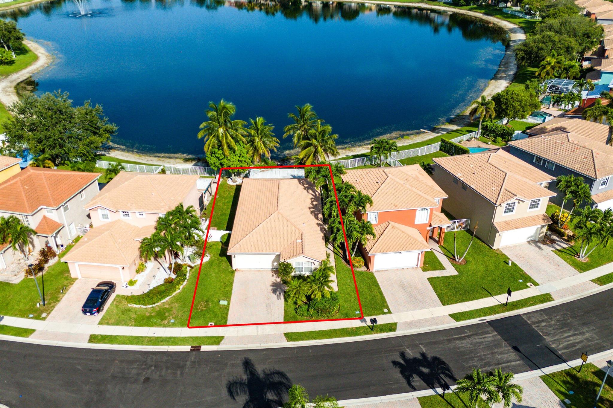 Welcome to this beautifully maintained 3-bedroom, 2-bath, 2-car garage waterfront home located in the desirable gated community of Liberty Isles within Briar Bay. Residents of Liberty Isles enjoy resort-style amenities, including a clubhouse, swimming pool, fitness center, and scenic landscaped grounds. The low HOA provides additional peace of mind by covering 24-hour security patrol, basic cable, pest control, landscaping, tree trimming, mulching, and common area insurance.From the moment you arrive, the brick paver driveway and walkway create a welcoming entrance that sets the tone for the charm found throughout this property. Step inside to an open-concept floor plan with soaring 10-foot vaulted ceilings, large diagonal tile floors, and updated trim and fixtures. Natural light