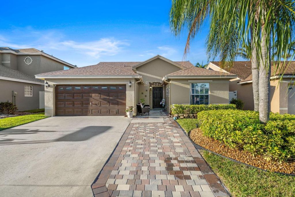 Photo of 160 Heatherwood Drive, Royal Palm Beach, FL 33411 (MLS # R10997383)