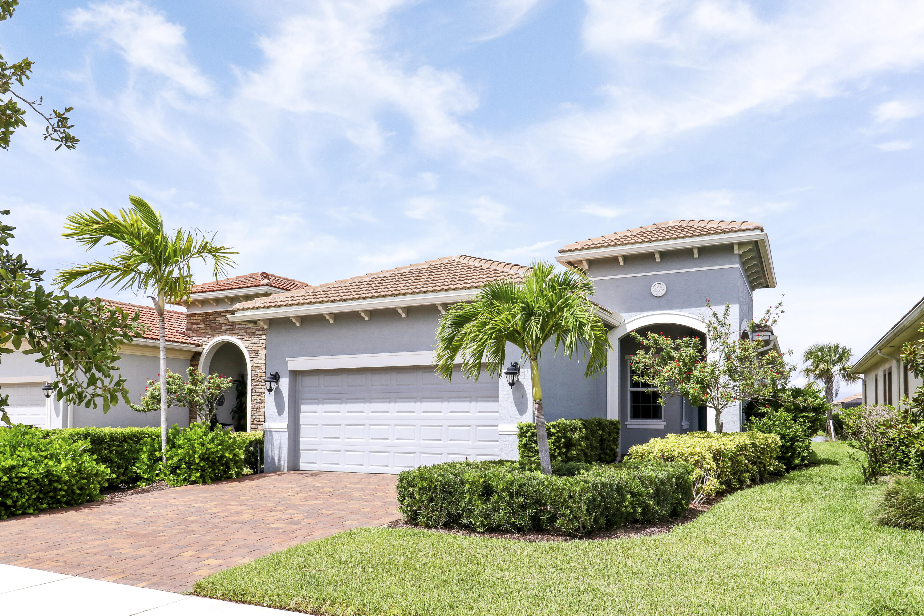 NESTLED ON A LAKEFRONT LOT and BRIMMING WITH UPGRADES, this 2BR+Den/2BA/2CG home is sure to please! The many features of this great-room style 'Casita' floorplan include glass entry front door, upgraded lighting & fans, wood-look tile flooring t/o main living areas & den, carpeted bedrooms, wood shelving in closets and much more! Entertainers will love the spacious kitchen featuring white cabinets w/ quartz counters, subway tile backsplash, apron sink, center island with pendants and waterfall edge plus dual breakfast bars! Upgraded stainless steel appliances and pantry with wood shelves! Master suite has lake views, a spa-like ensuite with dual vanities, walk-in tiled shower w/frameless glass door & spacious closet! The spare bedroom & den are located close to guest bathroom.