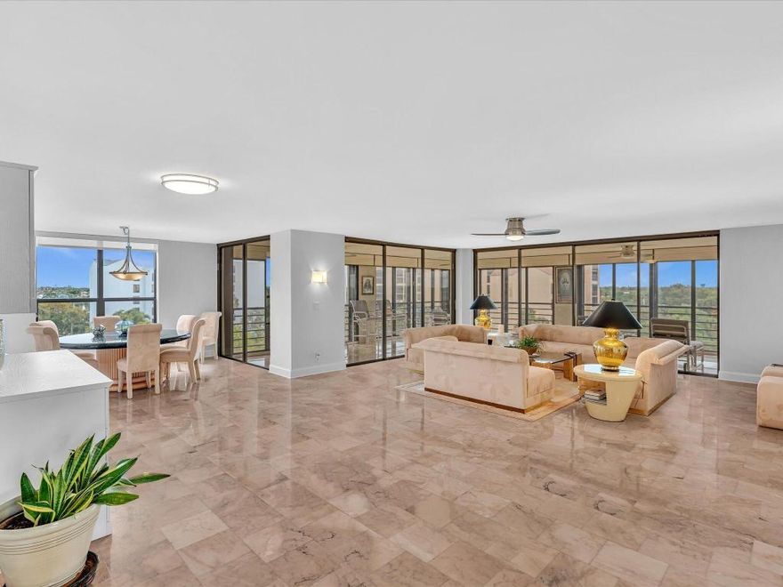 Panoramic views of Boca Raton and the sunsets from your bright 6th floor 3 BR/2.5 condo at Promenade Boca Pointe!  Impact glass all around including sliders on huge wrap around enclosed terrace, great for entertaining!  Gated community, secure lobby entrance, private elevator to two unis on each floor. Foyer entry, large granite kitchen, newer appliances, water heater. Breakfast room and additional office area off kitchen.  Updated modern interior doors, ceiling fans, lighting, window treatments, built ins, vanities. Smooth ceilings inside. Sold turnkey furnished (artwork excluded), move right in to enjoy all Boca Pointe has to offer. Optional memberships available. Adjacent to Promenade pool, close to main club.
Covered first parking spot next to entrance. Great Central Boca location!