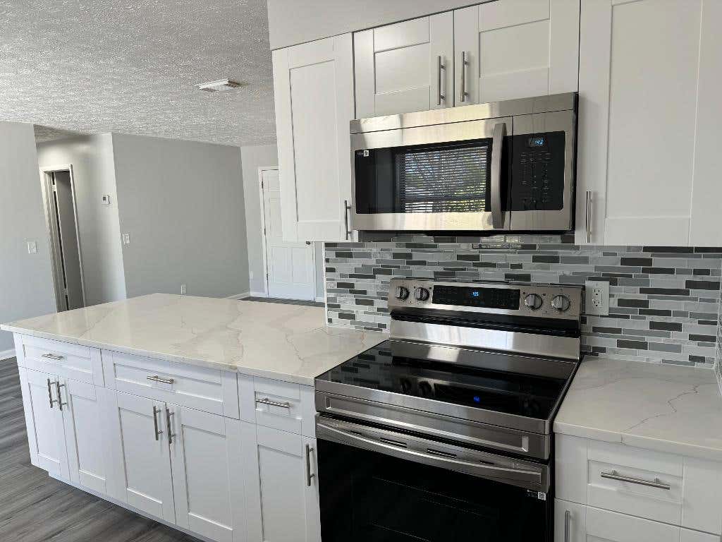 Photo of 1710 SW Monterry Lane, Port Saint Lucie, FL 34953 (MLS # R10962662)