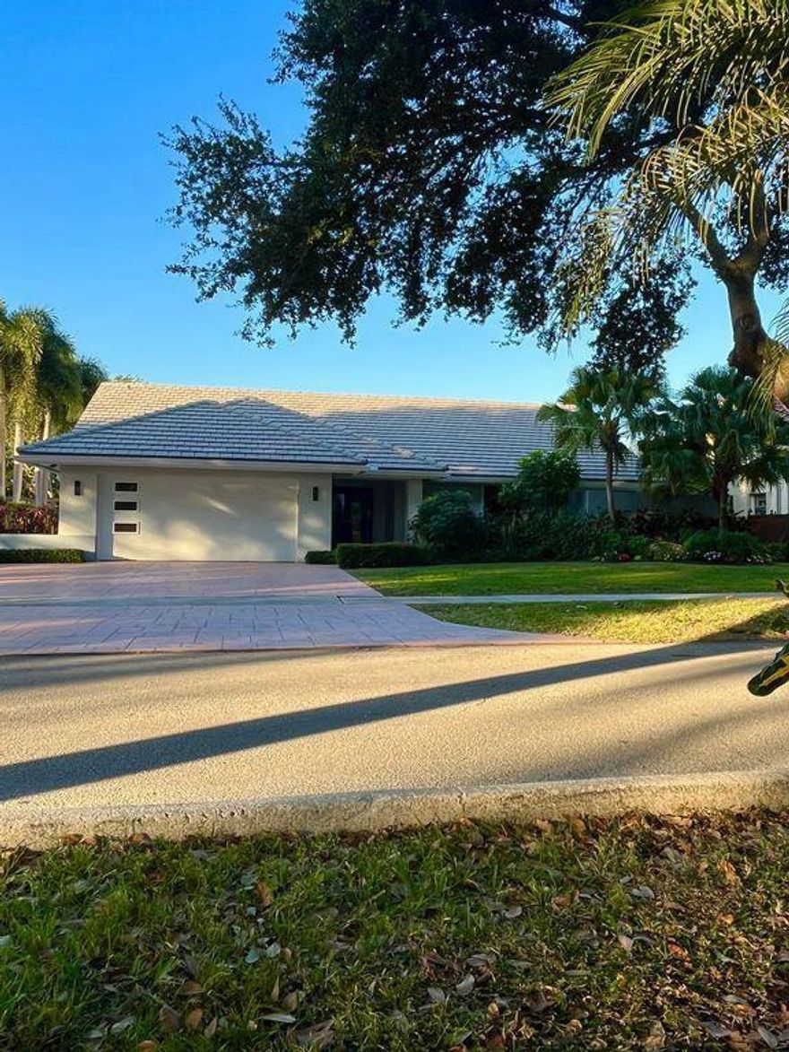 This spacious 3-bedroom, 2.5-bath "Colonnade" pool home is located in the sought-after 'St. Andrews Corridor' of Central Boca Raton. Offering a prime location within walking distance of top-rated Omni Middle School and Spanish River High School, this home is perfect for family living. The Boca Tierra Park, located within the subdivision, Step inside and discover a gorgeous remodeled kitchen, complete with granite countertops, new appliances, and plenty of space for cooking and entertaining. This home features three bedrooms, plus an additional office room, providing ample space for work or study. The backyard patio has been renovated with a raised wooden deck overlooking the pool. Hurricane-proof windows include accordion metal shutters for ease of use.