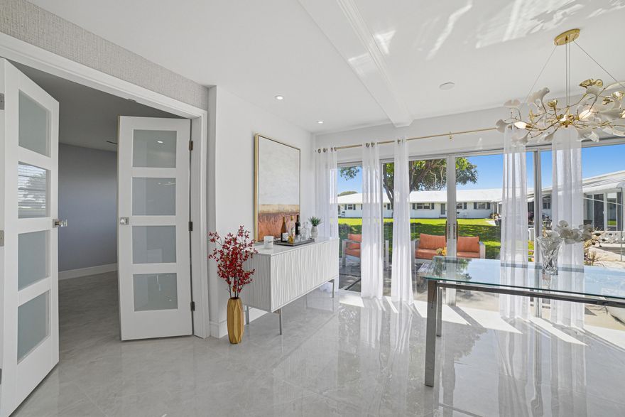 TOTALLY REMODELED First Floor Condo in a very active 55+ Golf Community. HURRY THIS LUXURIOUS, ELEGANT AND SPACIOUS CONDO IS AWAITING FOR YOU IN SUNNY FLORIDA'S PARADISE.Truly totally remodeled 2 Bedrooms 2 Baths condo is located in the very active 55+ Golf Community of Leisureville Golfview U3. In Boynton Beach. As a golfer here you play free of charge to your heart content, and if golfing is not your game, there are 3 gorgeous Club Houses, with pools and many other amenities that would keep you and your family occupied for most of the day. This gorgeous condo has been completely renovated with luxurious and modern décor featuring hurricane impact doors and windows for added safety and security.
...Very large porcelain tiles (48X48) imported from Spain. Designers drop down coffered ceiling like one may find in the Mansions on Palm Beach Island. The kitchen is equipped with soft close spacious cabinetry, cascading quartz countertop all new stainless-steel appliances, including a dual wall oven and microwave, cooktop with pot filler faucet, Oversized 36" fridge, for the master chef in you. The condo has a tankless water heater for energy efficiency. Also, this one of very few units in the community that already has a Washer and Dryer. The community is located in a lovely golf community and offers a serene and peaceful environment. The condo is perfect for those who enjoy golfing or simply want to relax and enjoy the beautiful surroundings. The location also offers vicinity to shopping, fine dining, entertainment, banking, medical, and the gorgeous white sandy beaches. If you are accustomed to the finer things in life, have a discriminating taste, and are looking for a gorgeous condo to call your own, look no further, you have found it! Do not delay schedule an appointment today.