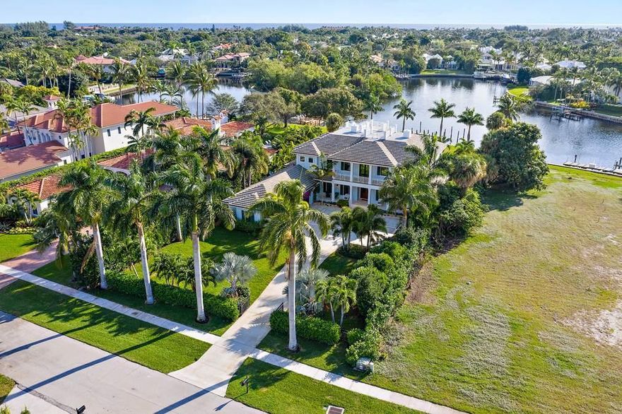 Located in the wonderful gated waterfront community of Captains Key, 12132 Captains Landing is a custom 4BR/5BA home built on a .65 acre lot that overlooks little Lake Worth. The British West Indies inspired residence has a master bedroom on the 2nd floor plus an elevator, a brand new sea wall with 103' of frontage, full house generator, gas fireplace, 3.5 car garage, laundry on both floors, extended covered patio and generous backyard. The second floor is complemented with an oversized covered balcony and a rooftop crow's nest to take full advantage of the long southern water views. The private dock makes this property perfect for anyone that enjoys boating ( up to est. 39' boat) and water sports with close proximity to intracoastal waterway & Atlantic ocean.
