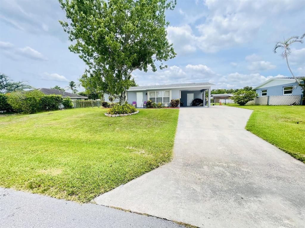 Photo of 4124 Colle Drive Dr, Lake Worth Beach, FL 33461 (MLS # R10816554)