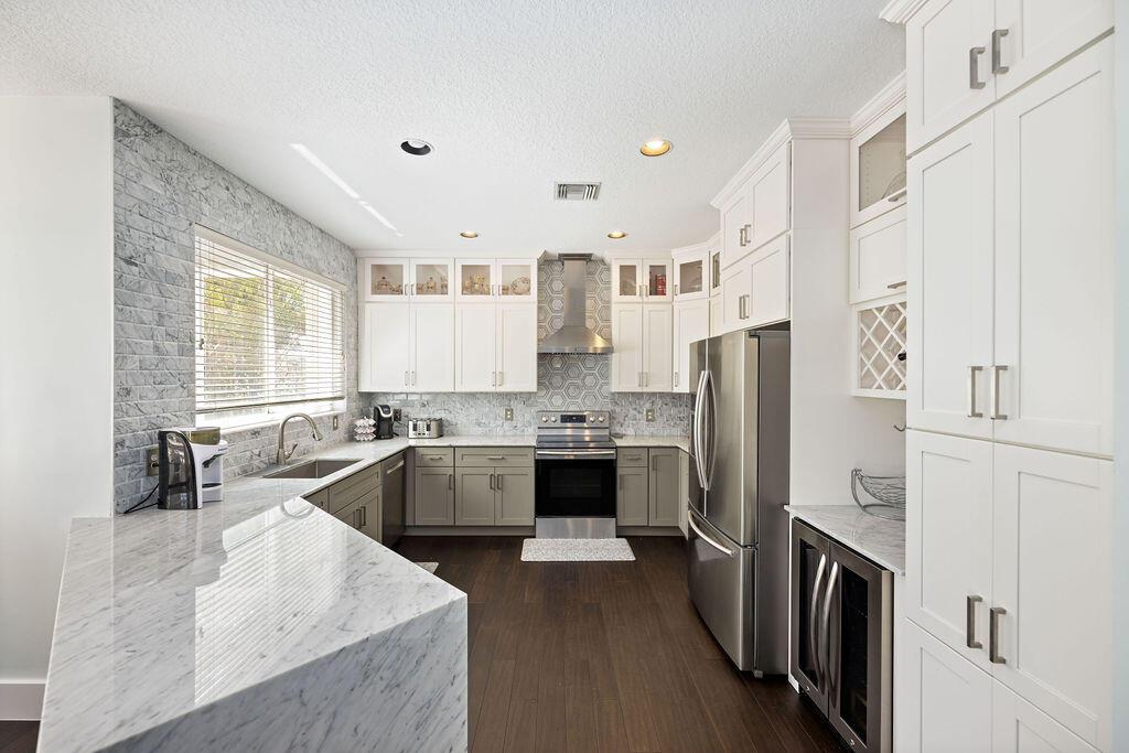 Available due to relocation.Beautifully updated 4 bedroom 2.5 bath. w/ water views. Marble countertops, Custom pantry. Oversized primary suite feat. tray ceiling, bonus space, 2 walk-in closets, and spa-like en suite. Recent improvements include A/C, smart thermostat, w/d, exterior paint, panel blinds for patio, & improved windows. Quick access to I95..Access to community pool!