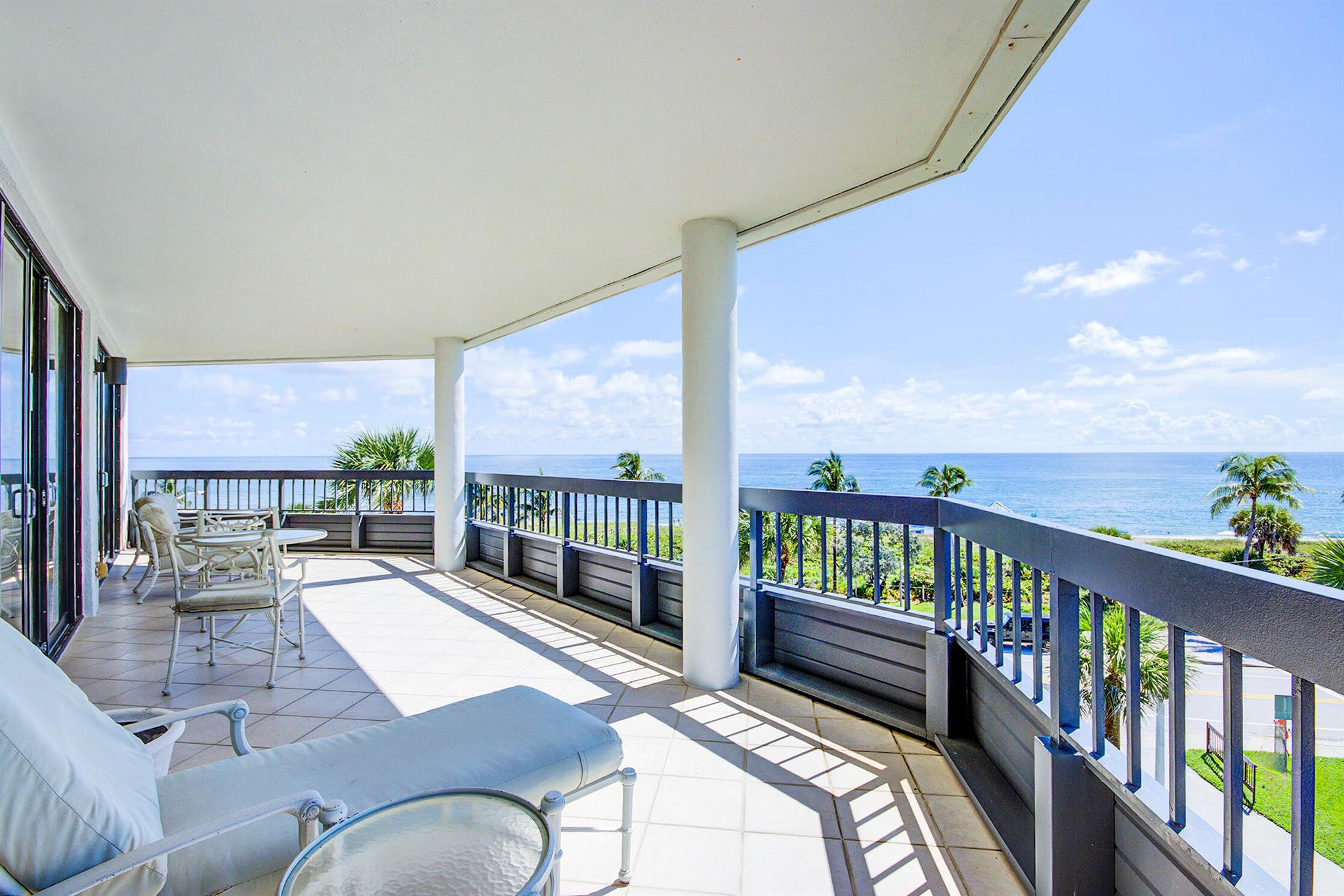 Experience the ambiance and quality of a 5-star hotel in this fully furnished, turnkey paradise. This luxurious 2-bed, 2-bath residence features stunning, completely unobstructed ocean views from every room--a priceless amenity you can enjoy without stepping onto the sand. The interior is a showcase of coastal elegance, featuring sophisticated tile floors and classic plantation shutters. Private patios offer the perfect vantage point to take in the breathtaking panorama. Best of all, you are just a short, direct stroll across to the beach and only moments away from the vibrant dining and chic shopping of Atlantic Avenue. This is prime coastal living with unbeatable views and unmatched convenience.