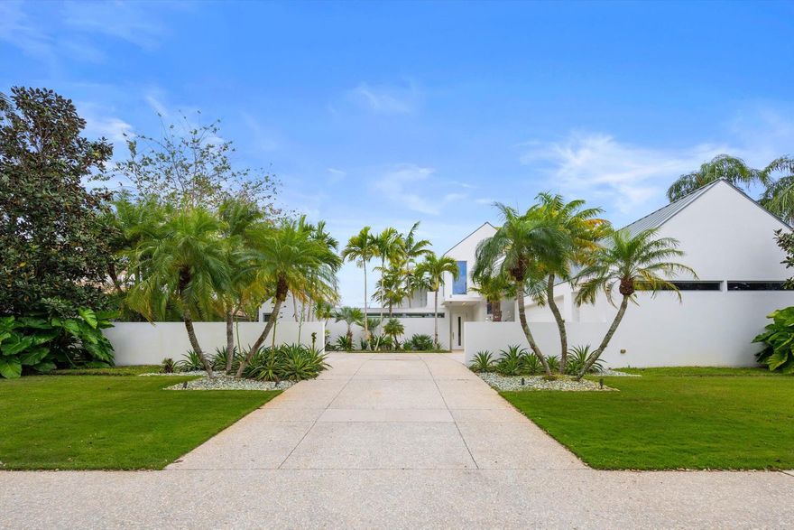 Custom-built in 2014 and winner of the 2015 Design Award from the American Institute of Architects, Palm Beach Chapter, this stunning home is a masterpiece of modern design. Thoughtfully crafted to maximize natural light and seamless indoor-outdoor living, the open-concept layout flows effortlessly to breathtaking lake and golf course views overlooking the 14th fairway. A striking 50-foot lap pool enhances the outdoor oasis, perfect for relaxation or fitness. Inside, high-end finishes, a gourmet kitchen, and a luxurious primary suite create an unparalleled living experience. Nestled within the Loxahatchee Club, an award winning golf club community ranked #17 in Forbes Magazine, Most Exclusive Golf and Country Clubs. Located in Jupiter near top-rated schools, shopping, and pristine