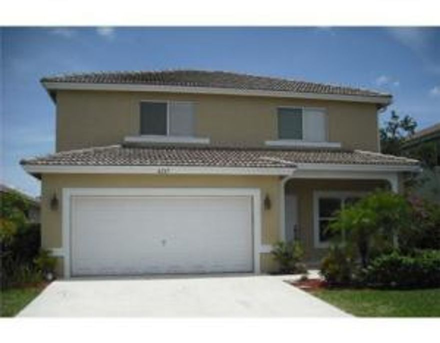 Spacious 4 bedroom home with beautiful lake view, fully fenced yard and room for a pool.  Big eat-in kitchen, newer stainless steel appliances and pantry. Breakfast area has sliding doors leading to the rear yard. Spacious, with lots of natural light this is a  true family home with living room and den/family room or formal dining area leading off of the kitchen.  Long lake views from breakfast area, Dining/Den and kitchen.  Fully tiled downstairs, bedrooms are all newer wood floors.  Master bath features dual sinks, separate shower and roman tub.  Plenty of storage in this home including inside Utility room with storage cabinets. 2 car garage with reinforced garage door, hurricane shutters for all openings.  Willoughby Farms is a gated community with easy access to I95.