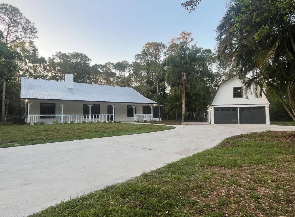 Photo of 13018 153rd Road N, Jupiter, FL 33478 (MLS # R11079652)