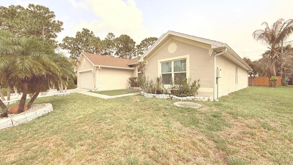 Photo of 1613 SW Whipple Avenue, Port Saint Lucie, FL 34953 (MLS # B26043550)